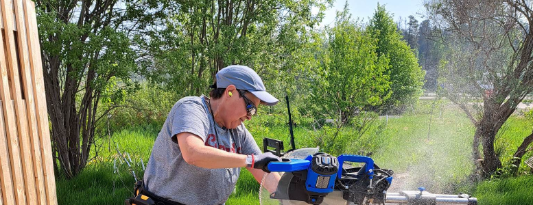 Woman working with saw